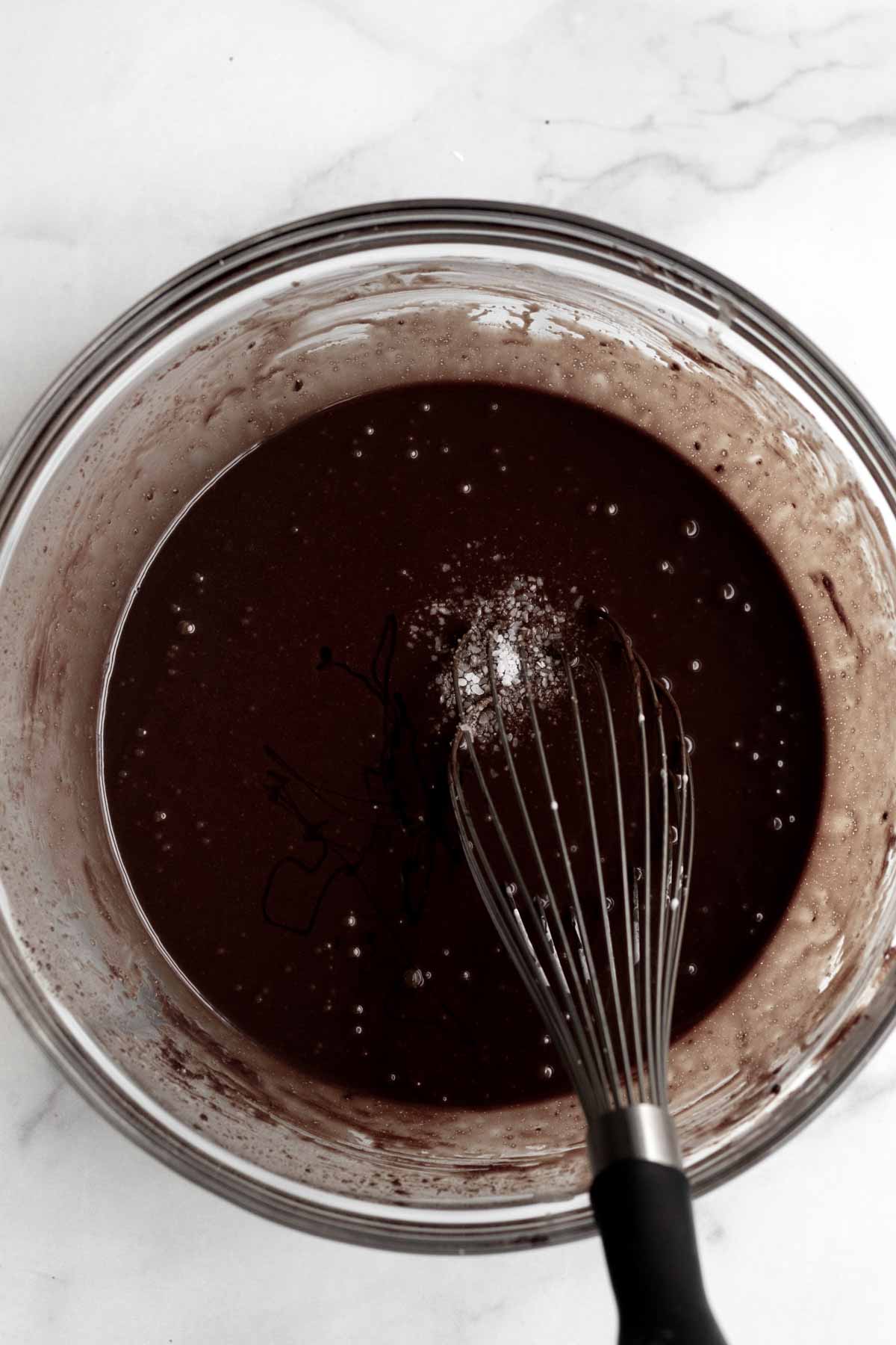 Mixing in the salt into the chocolate batter.
