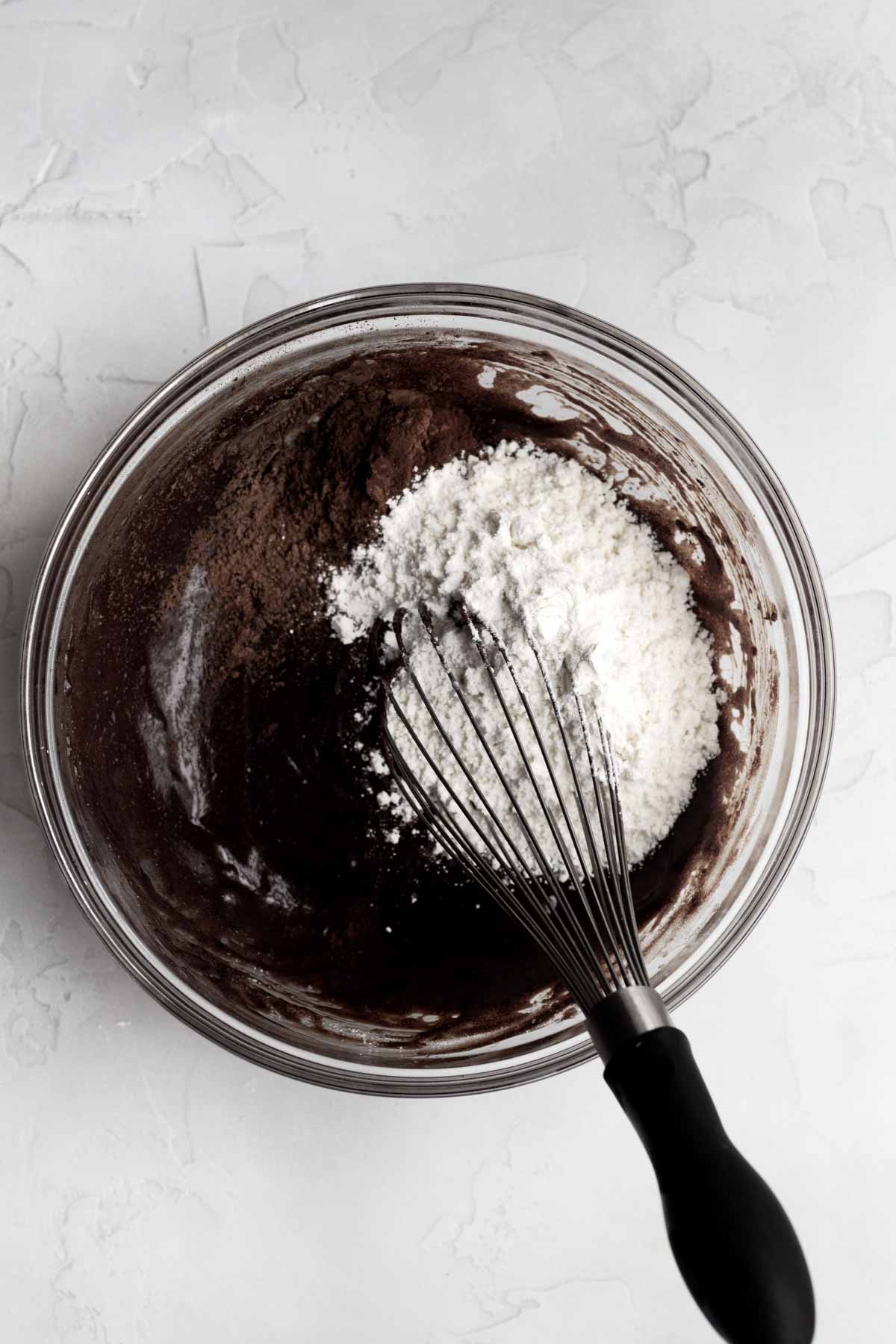 Whisking the cocoa powders and flour.