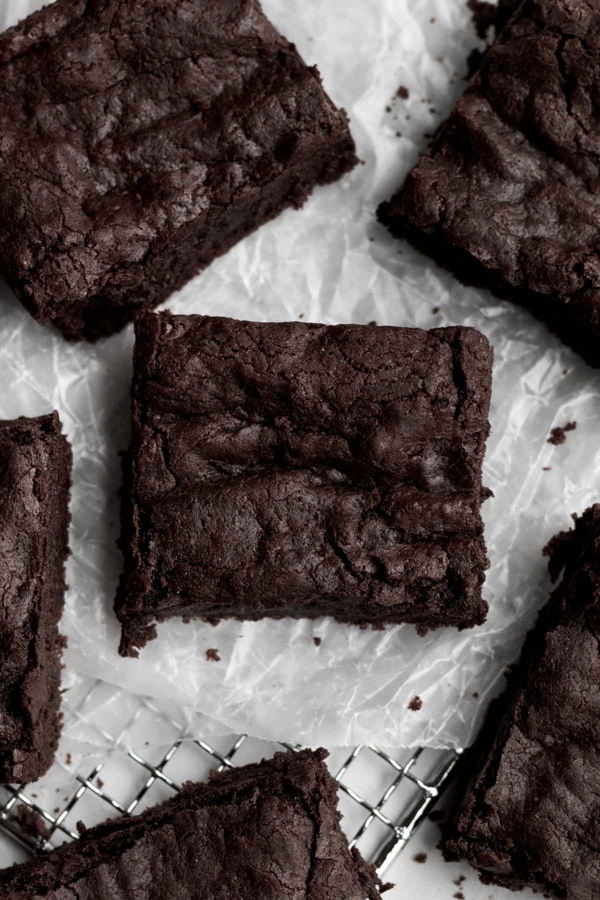 The crisp outer shell of chocolate cake holds bak the fudge interior of this brownie square.