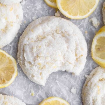 A delicious gluten free Lemon Sugar Cookie with a bite taken out.