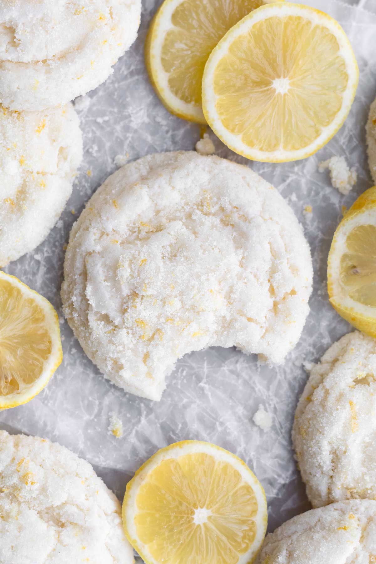 A delicious gluten free Lemon Sugar Cookie with a bite taken out.