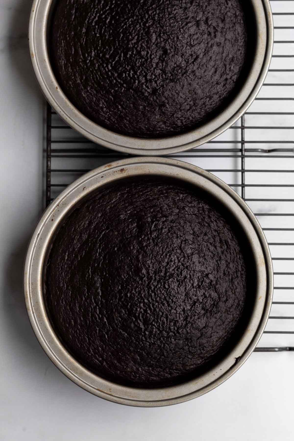 Baked chocolate cake bread in cake pans.