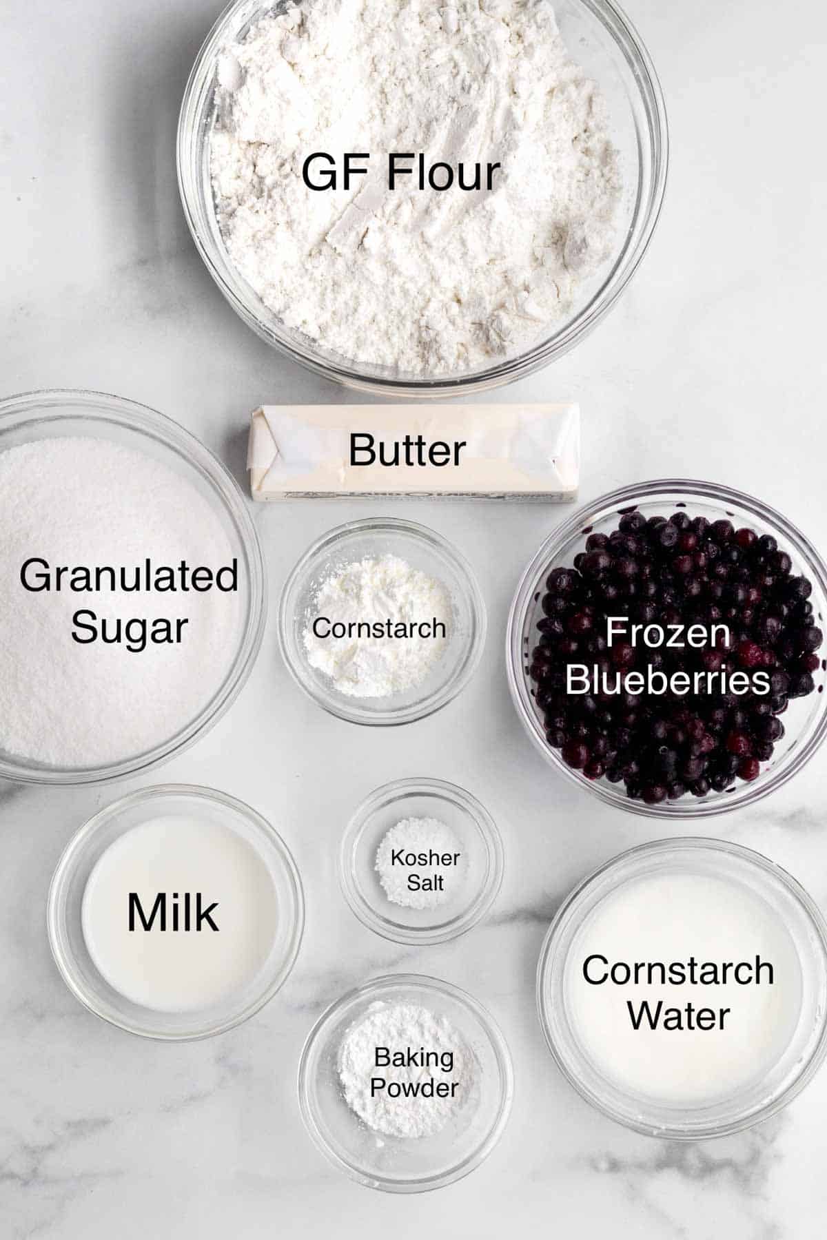Gluten free flour, butter, granulated sugar, cornstarch, frozen blueberries, kosher salt, milk, baking powder and cornstarch water in separate containers.