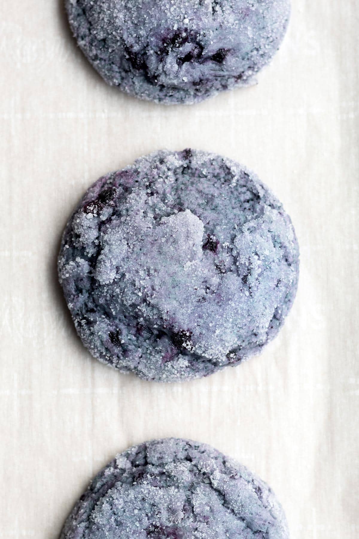 Baked and fresh Blueberry Cookies on parchment paper.