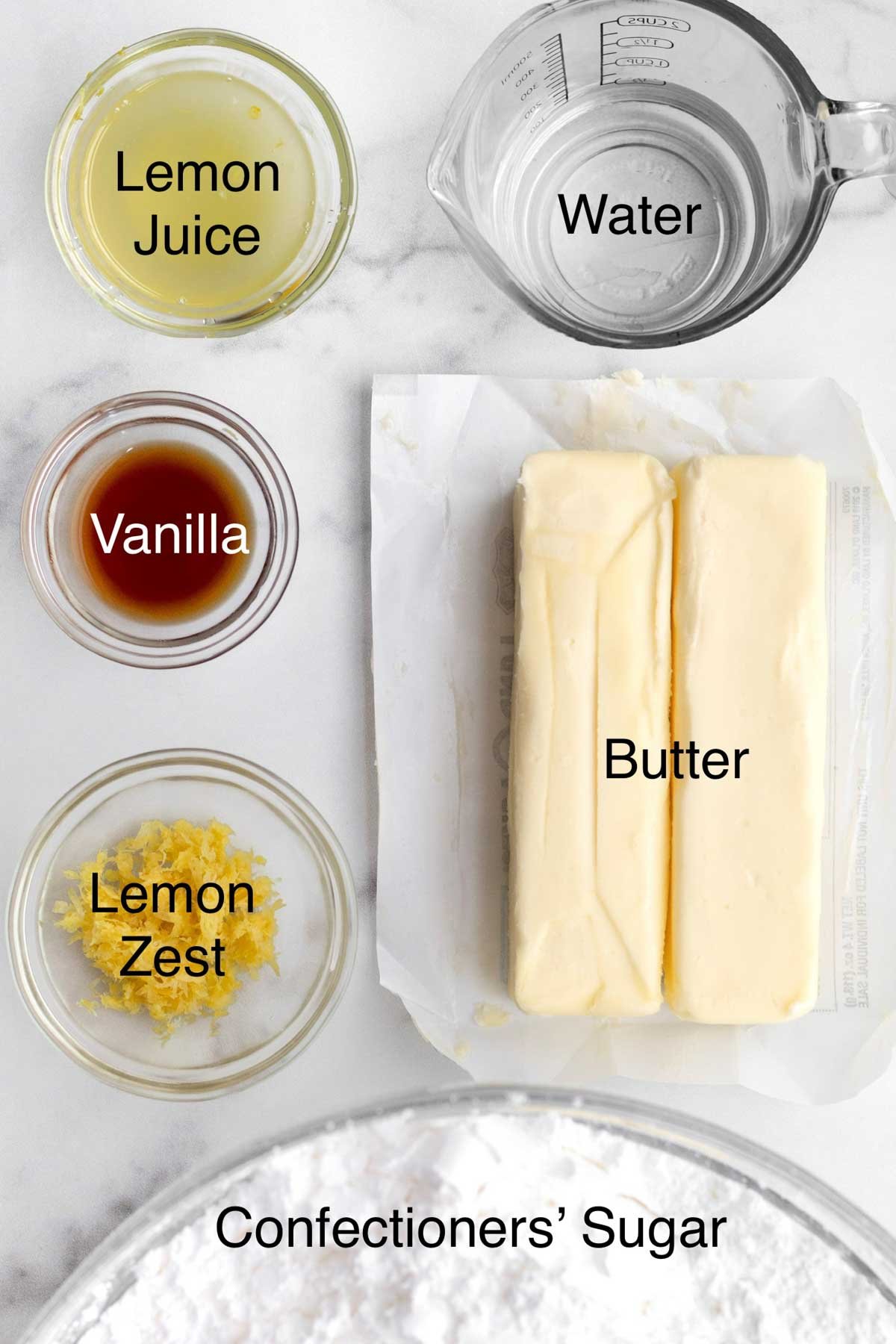 Lemon juice, water, vanilla, butter, lemon zest and confectioners' sugar all in separate containers.