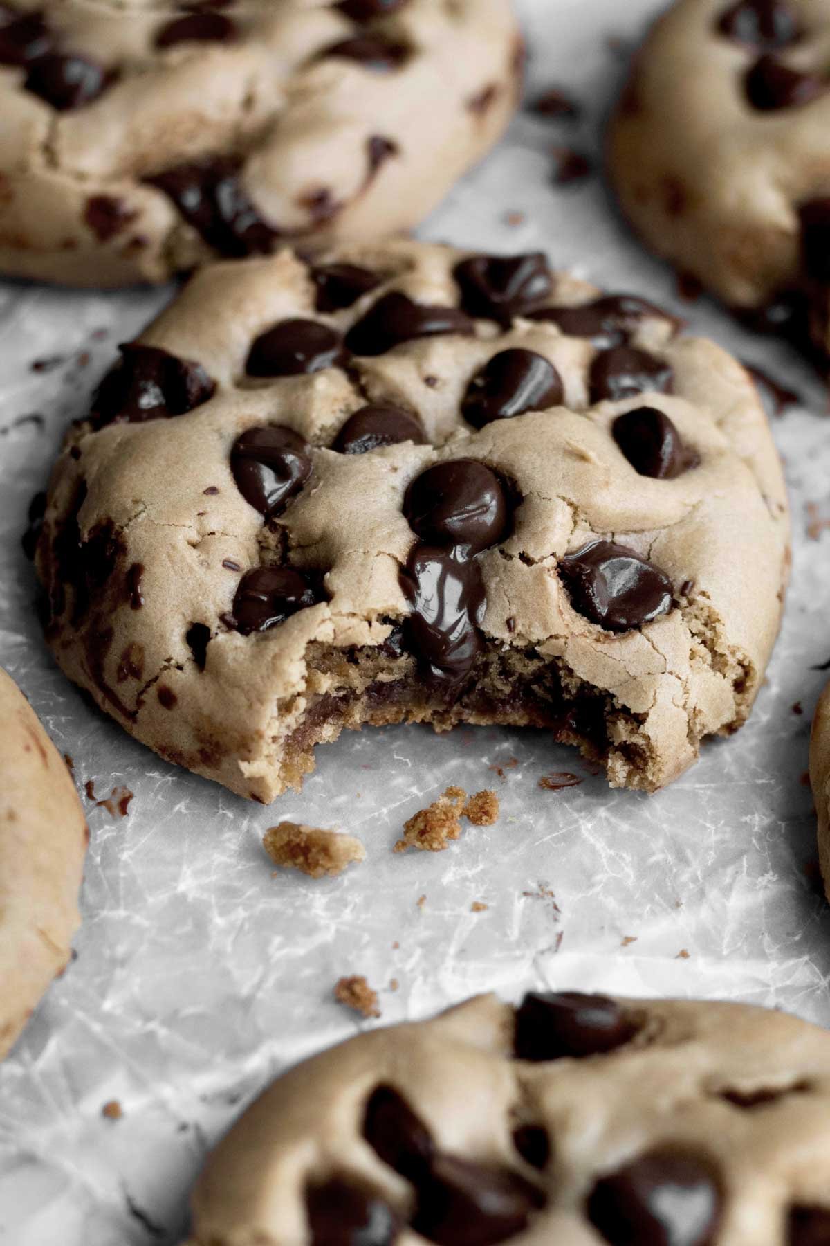 A bite reveals the cookie's crisp outer edges and chewy inner texture.