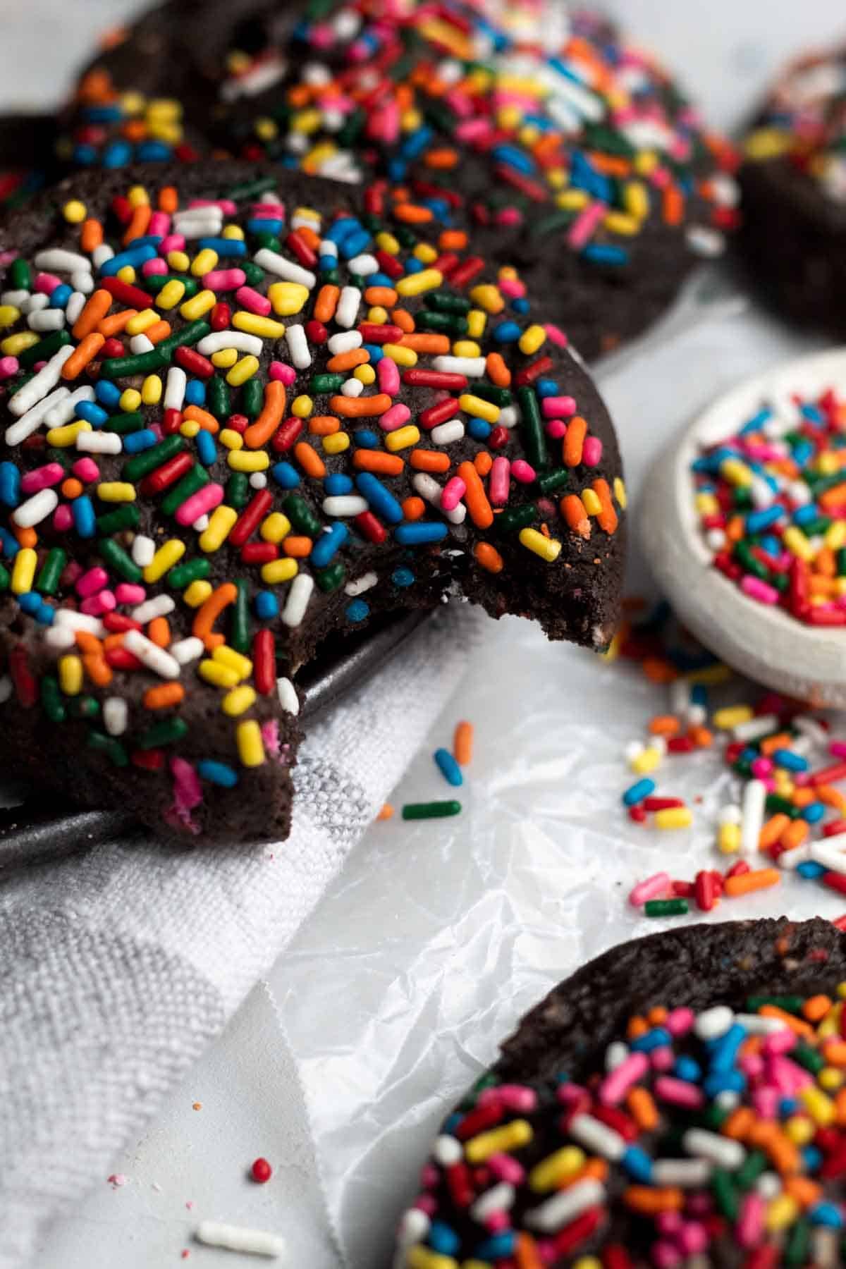 A plate overflowing with dark and delicious soft homemade Chocolate Sprinkle Cookies.