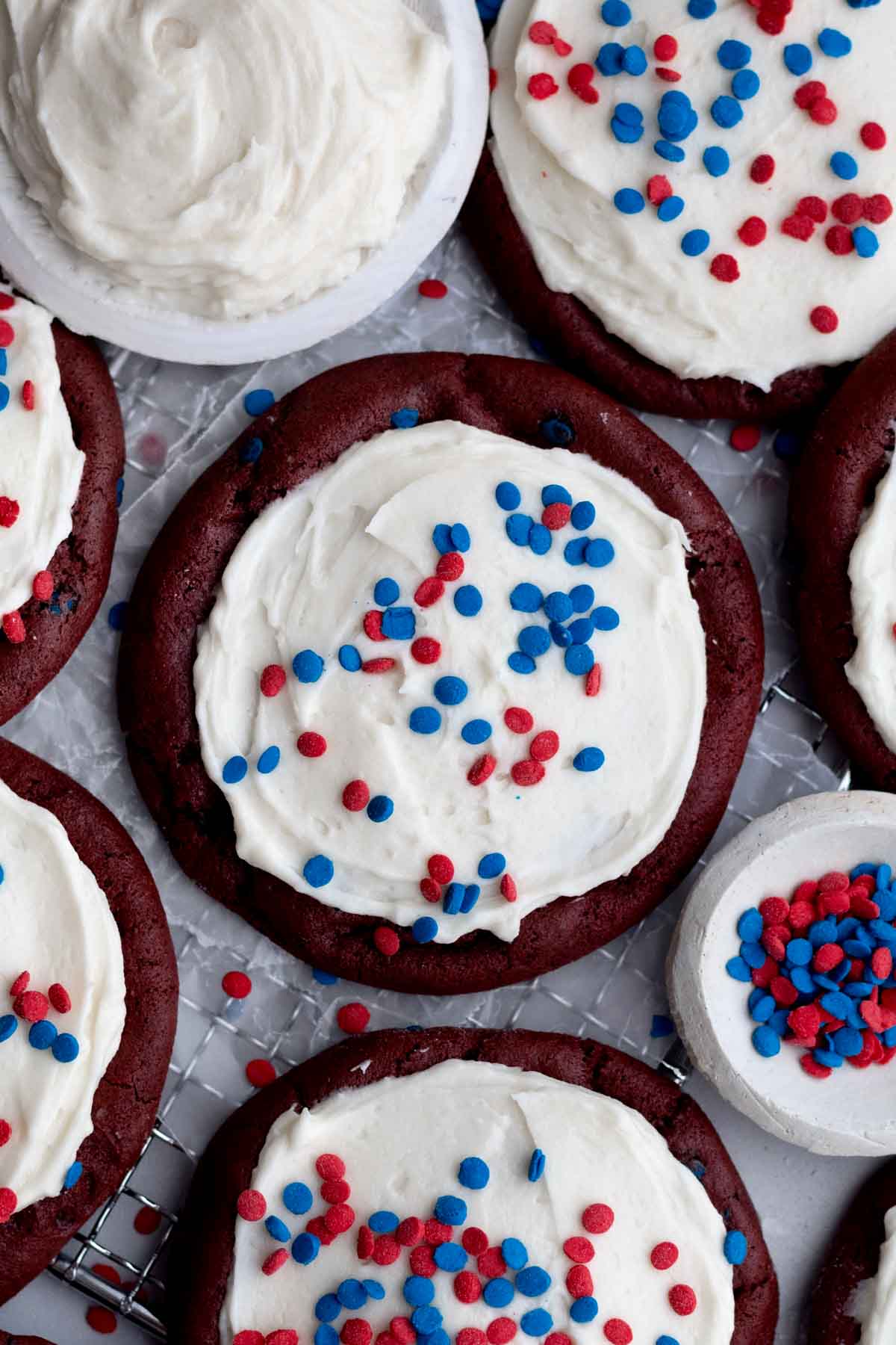 Red and blue round sprinkles top the sweet vanilla frosting of the 4th of July Cookies.