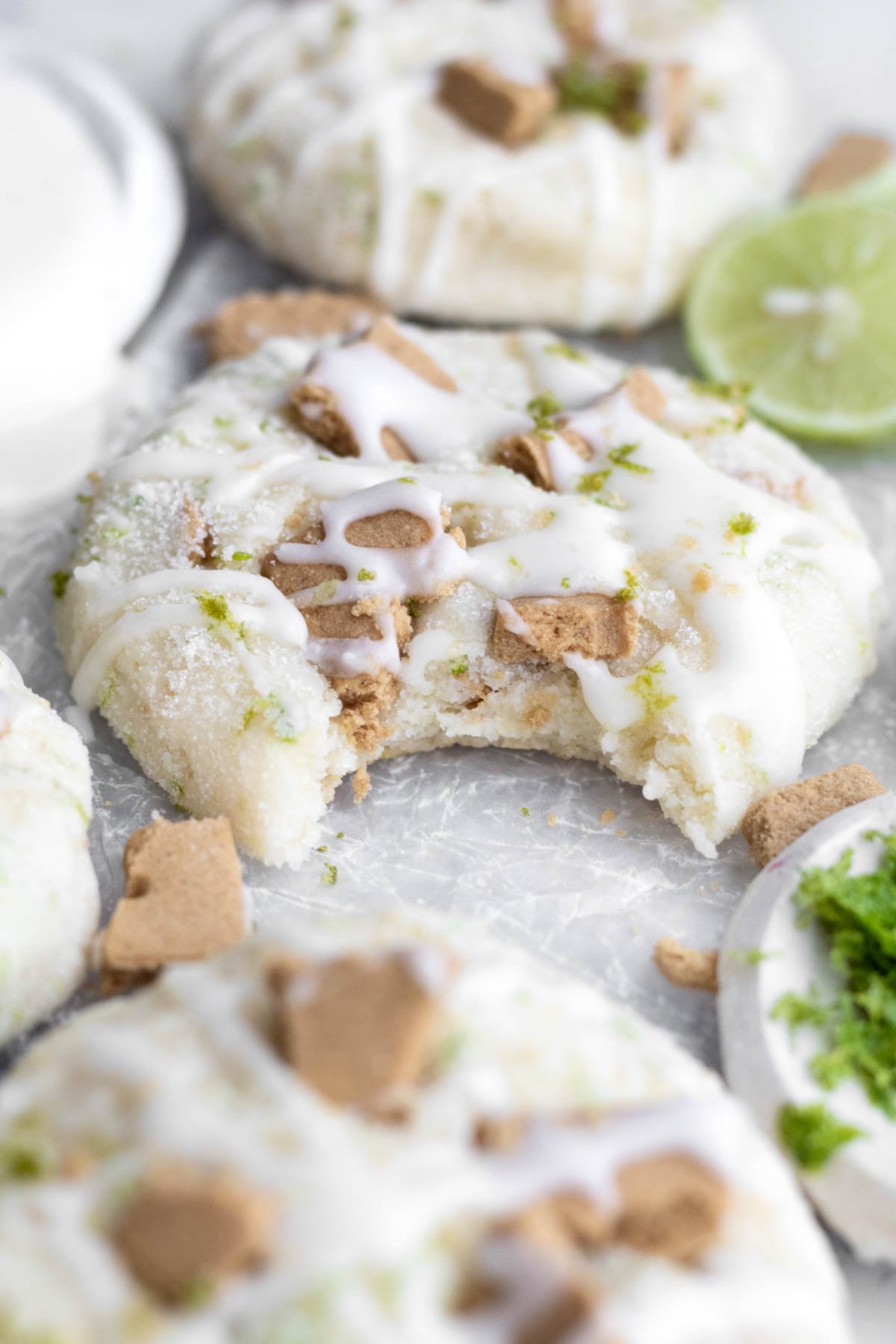 A sugar dusted Key Lime Cookie that’s bitten reveals its soft and warm interior.