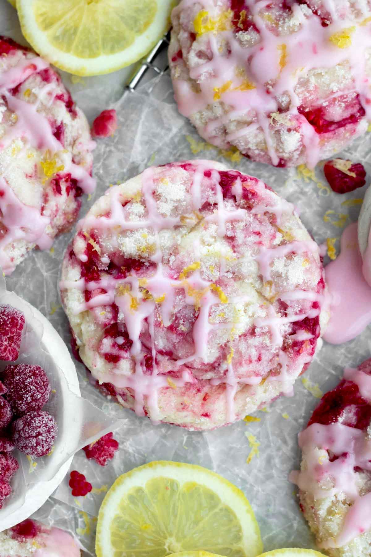Raspberry breaks through bright red cracks the cookie with shards of lemon zest and pink glaze.