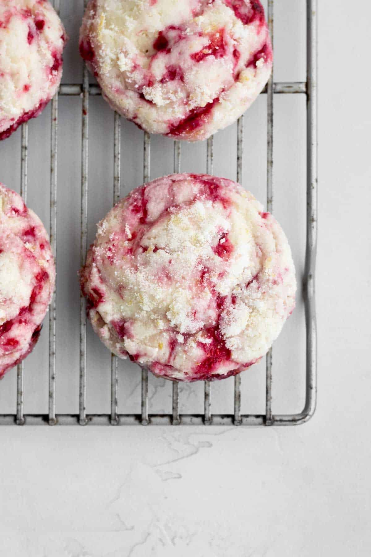 Fresh warm baked cookies with raspberry highlights.