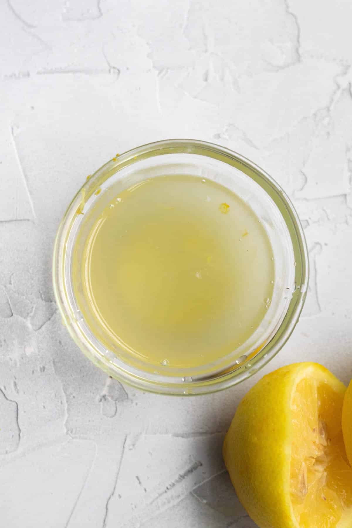 Fresh squeezed lemon juice in a bowl.