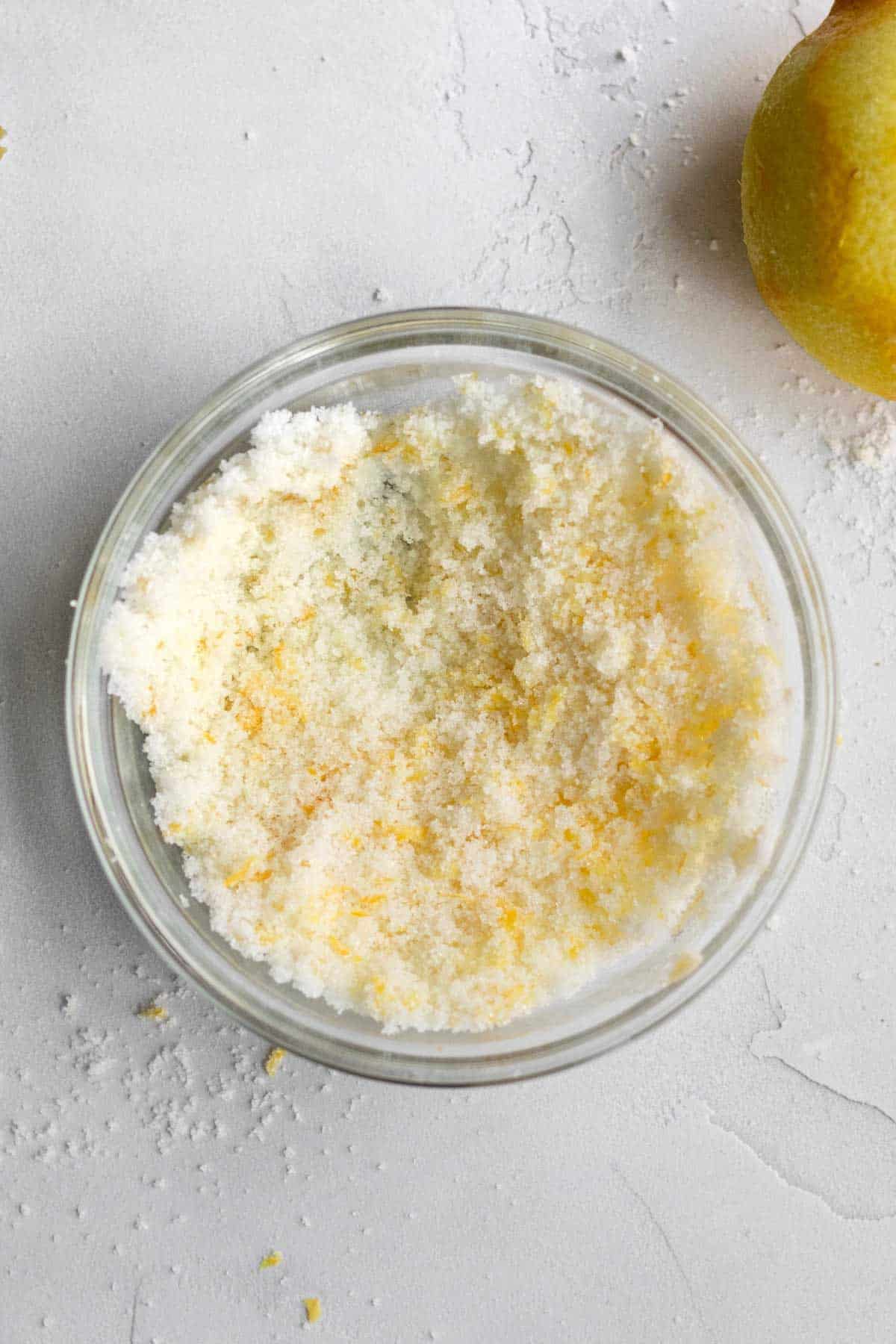 Lemon zest mixed into the bowl of sugar.