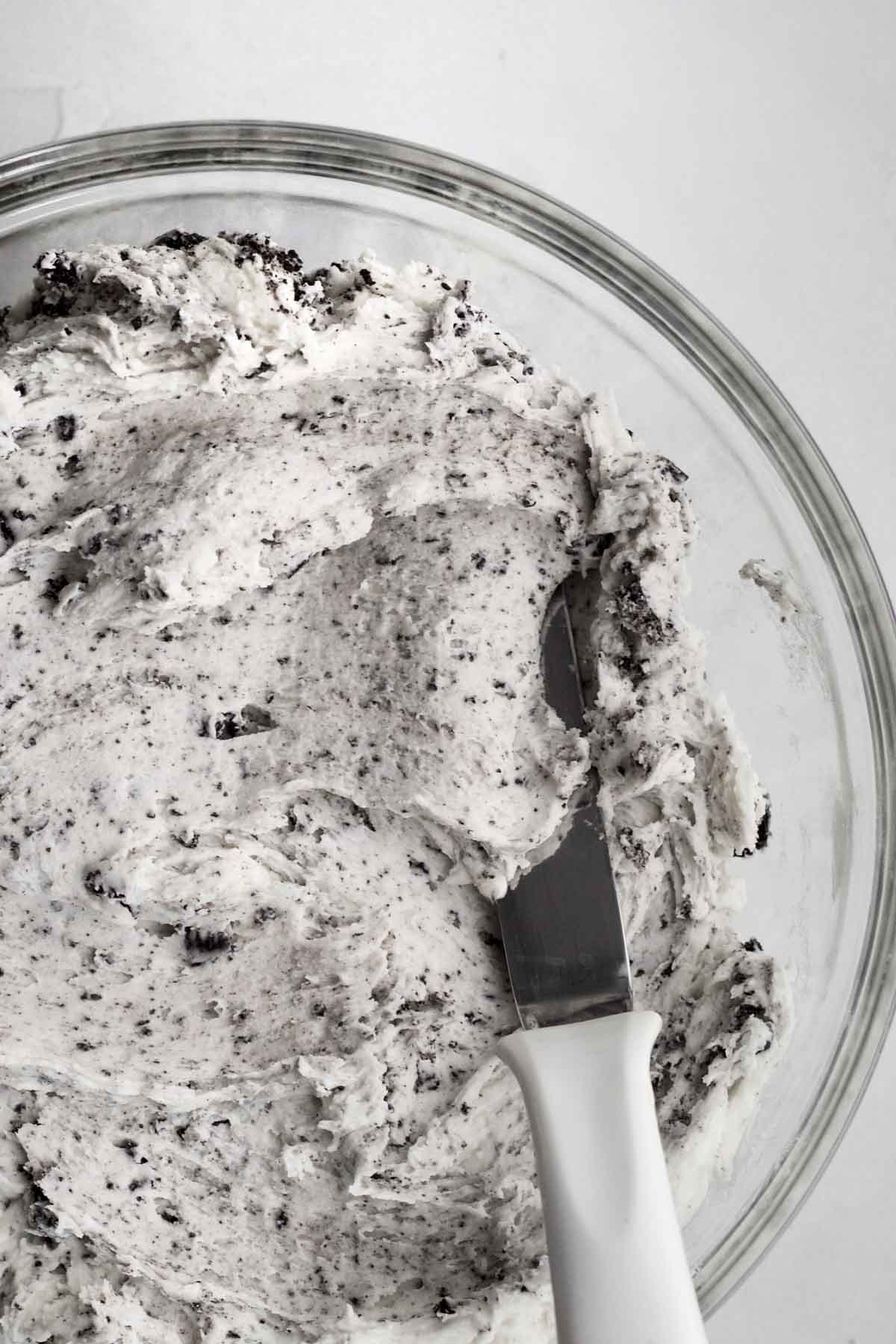 Delicious cookies and cream frosting with bits of chocolate sandwich cookie.