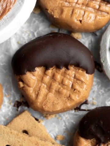Tan and delicious Gluten Free No Bake Cookies topped with rich Wow Butter chocolate spread.