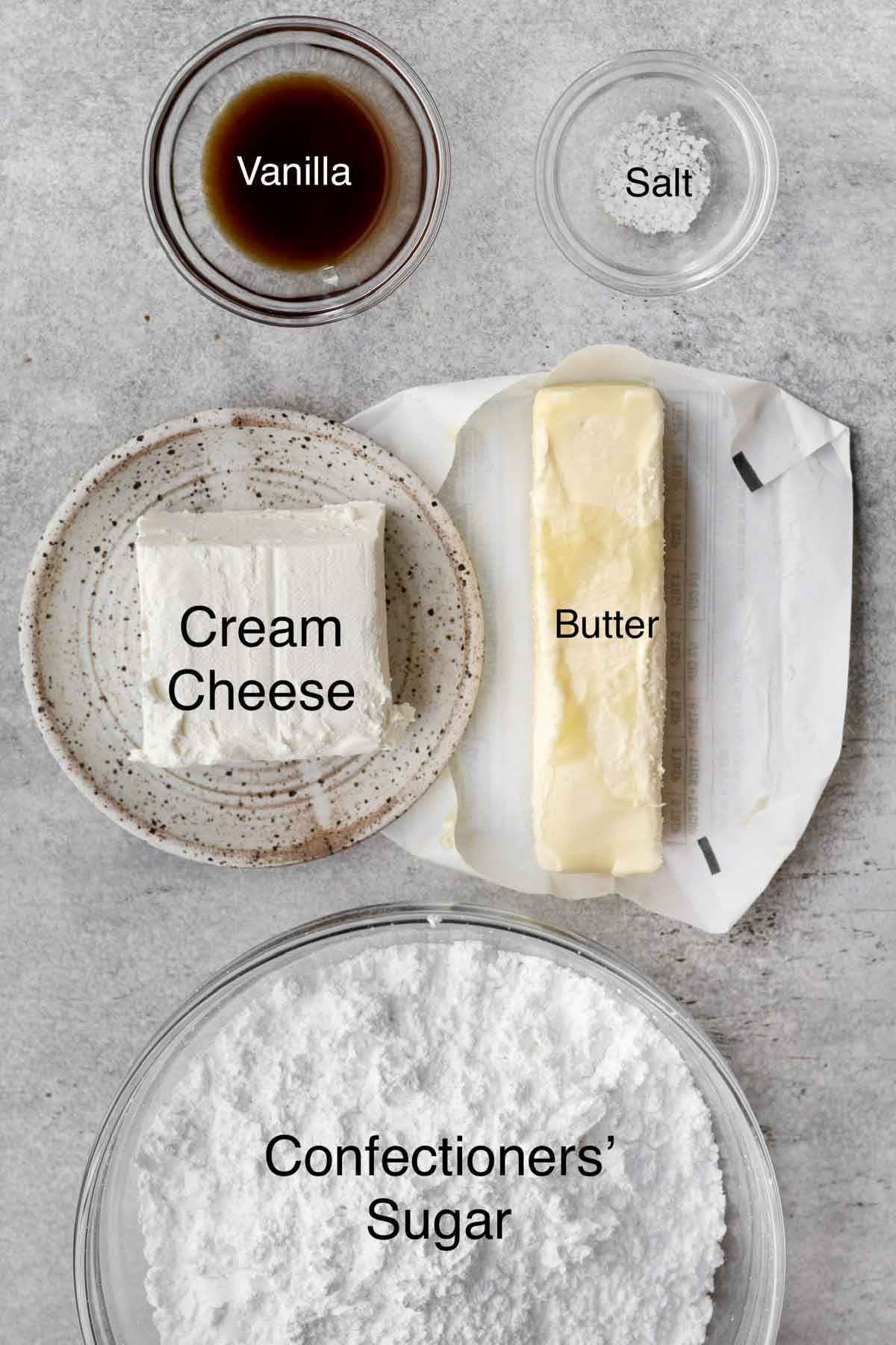 Vanilla, Salt, Cream Cheese, Butter and confectioners' sugar in seperate containers.