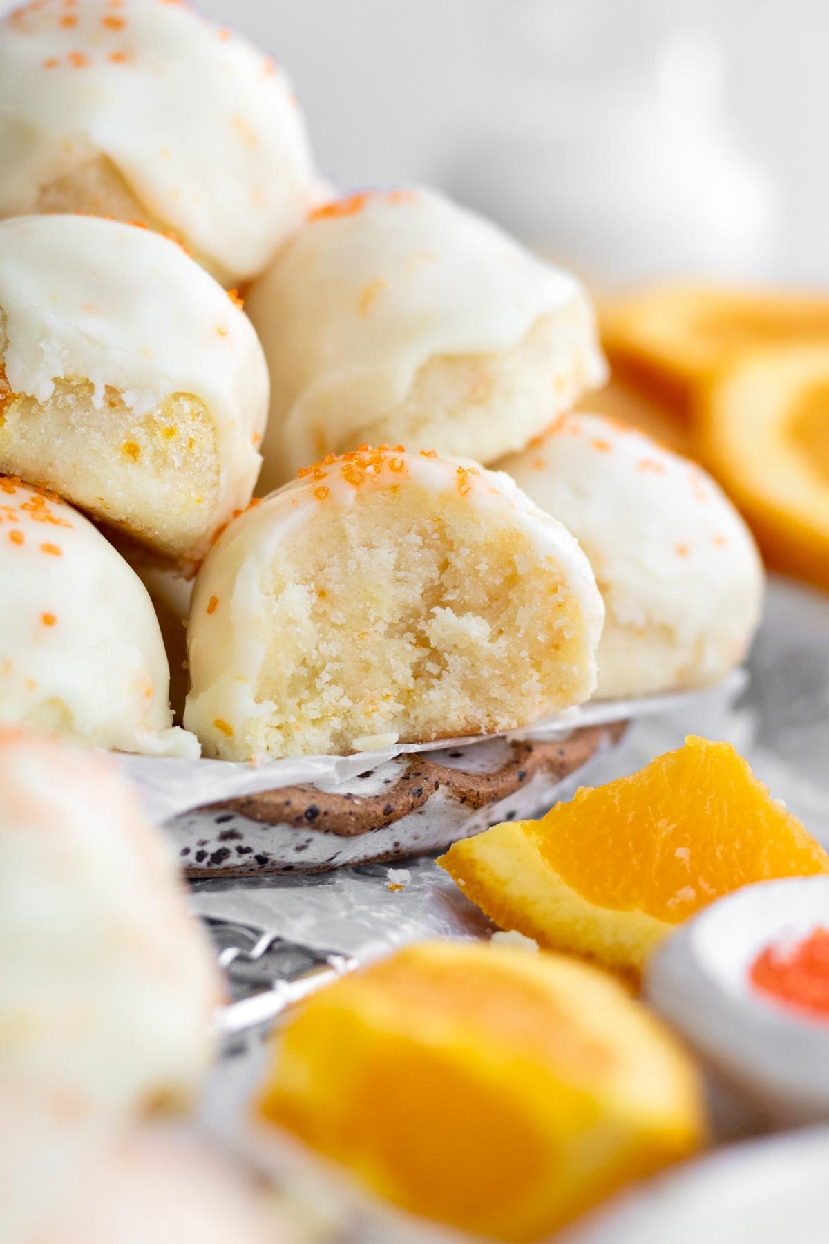 A bite reveals the tender tangy moist crumble inside of the Orange Shortbread Cookies.