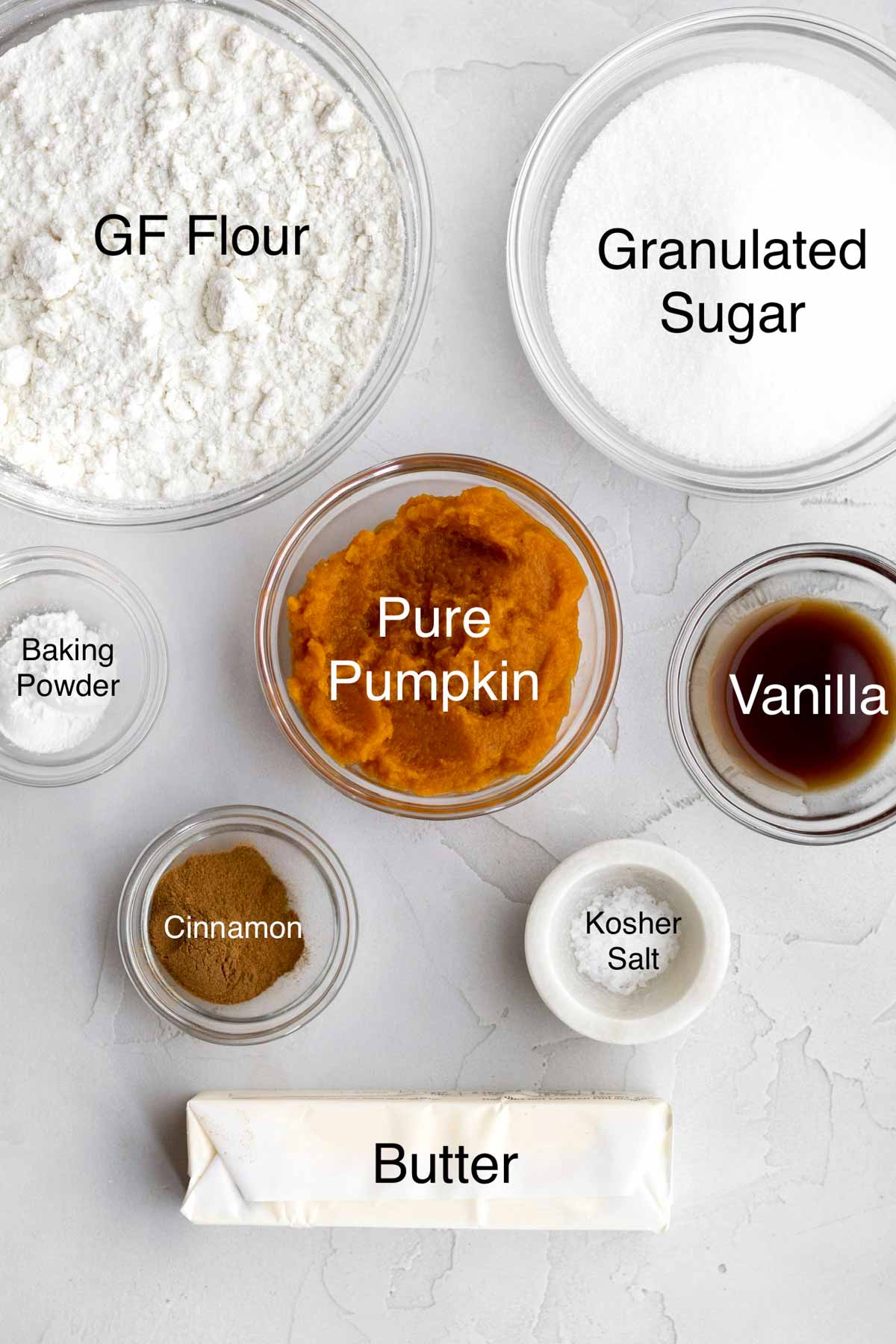 Gluten free flour, granulated sugar, baking powder, pure pumpkin, vanilla, cinnamon, kosher salt and butter in separate containers.