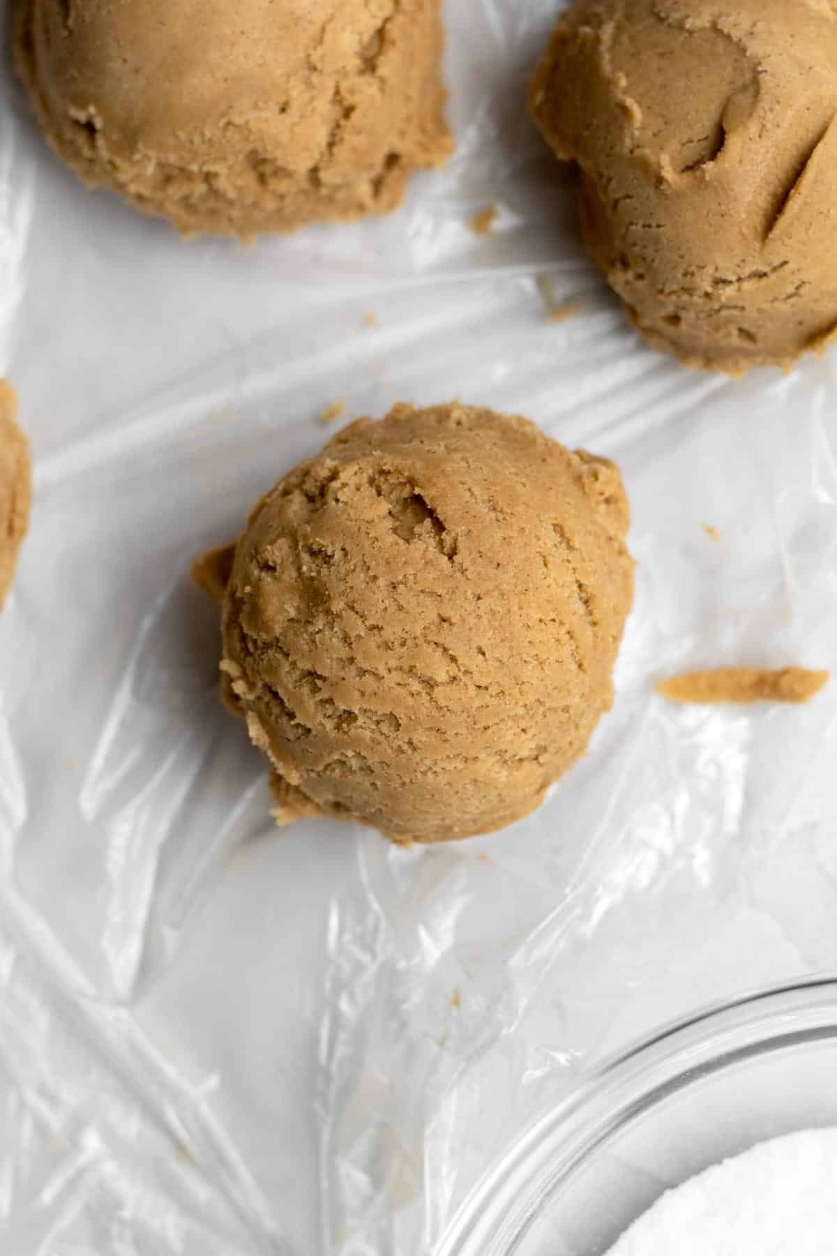 Scooping balls of ginger cookie dough.