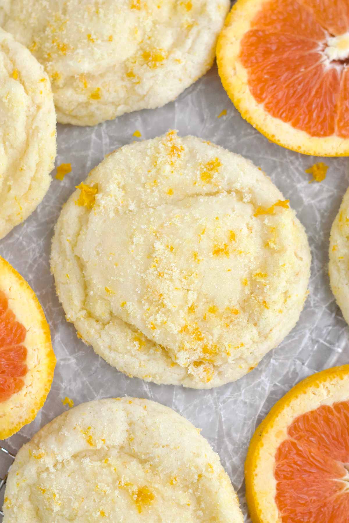 A delicious sugary Orange Cookie with bright tangy flecks of orange zest embedded throughout.