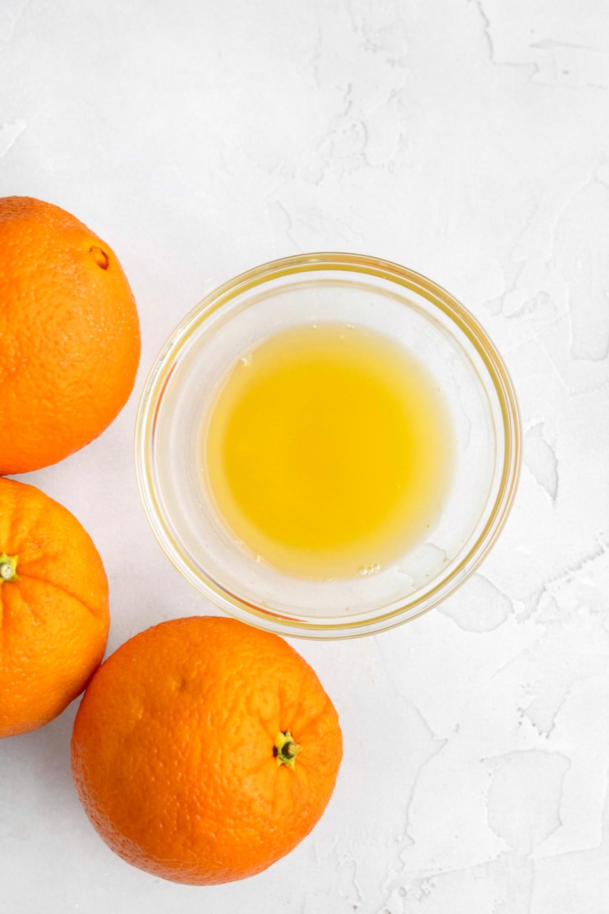 A bowl of fresh squeezed orange juice.