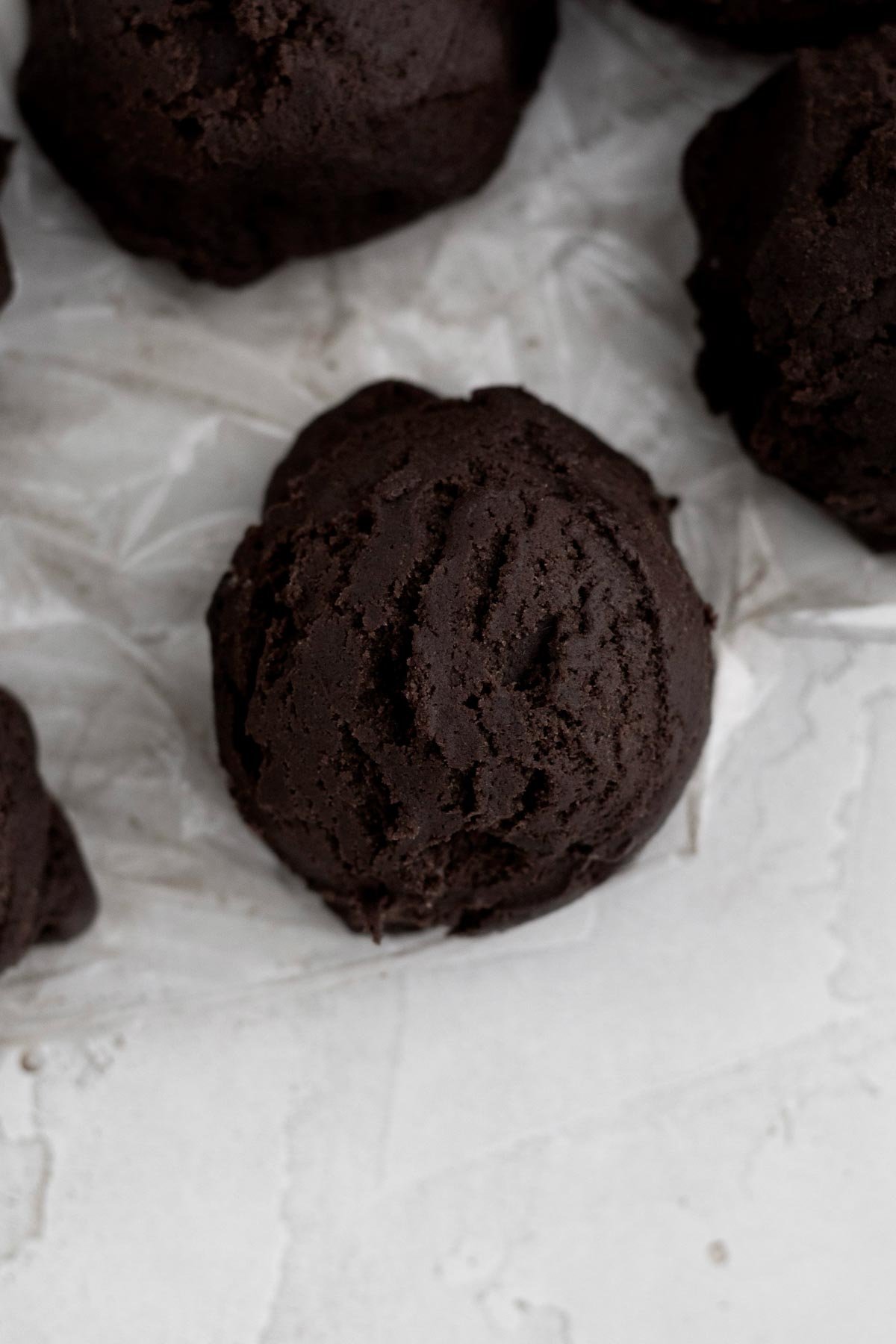 A scooped ball of chilled chocolate cookie dough.