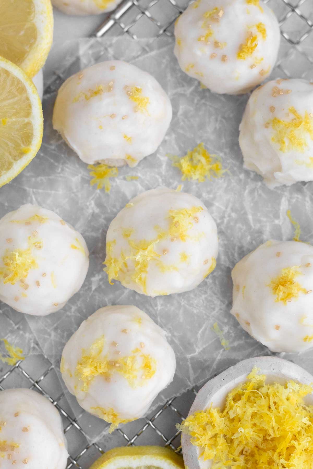 Bright lemon zest and gold sprinkles rest atop the lemon glaze of the Lemon Shortbread Cookies.