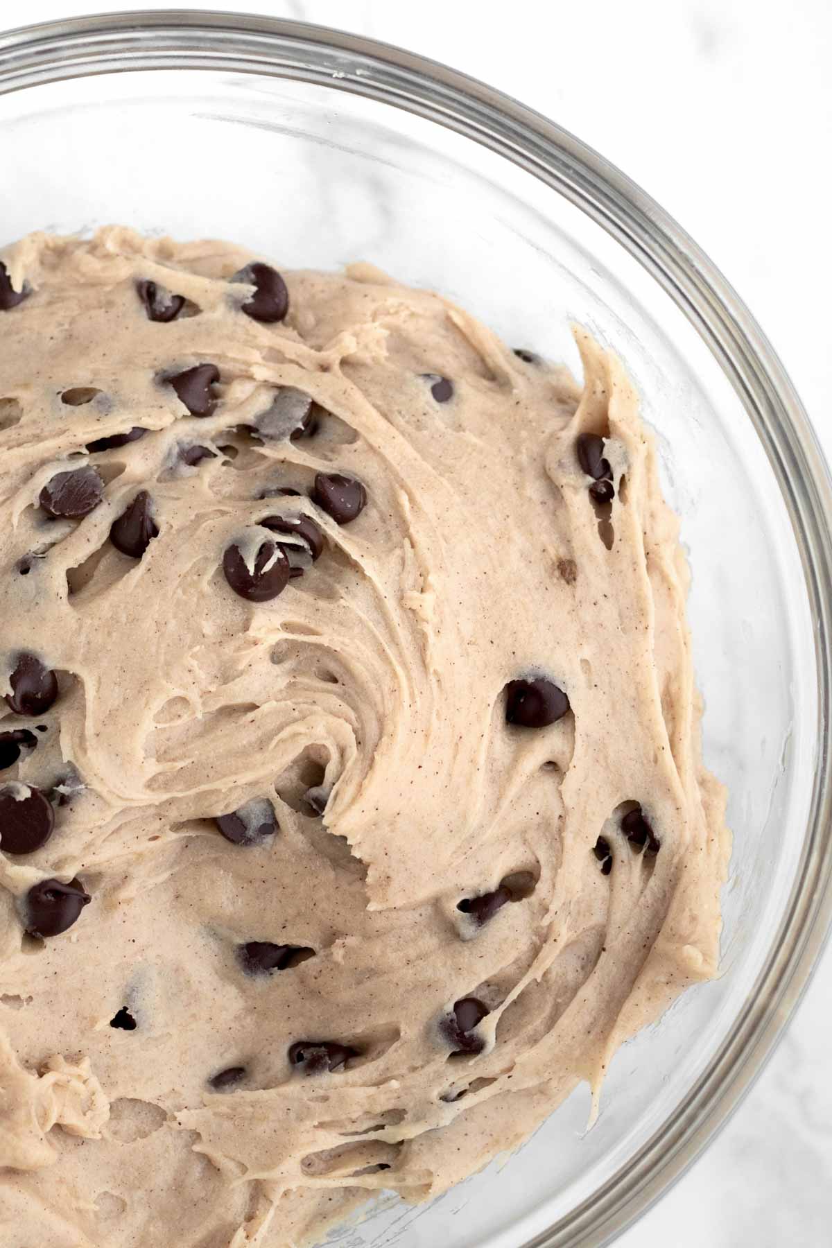 Adding chocolate chips into the Banana Bread Cookie dough.