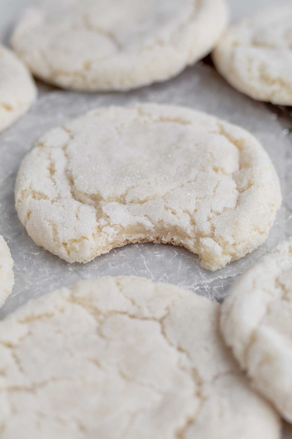 A bite through the Crispy Sugar Cookie's reveals a warm soft interior.