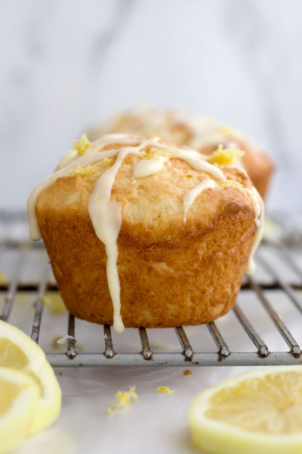 Lemon zest and lemon glaze drizzled atop the Lemon Muffin.