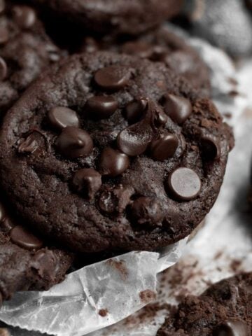 A plate of delicious Mini Chocolate Cookies with melted mini chocolate chips.