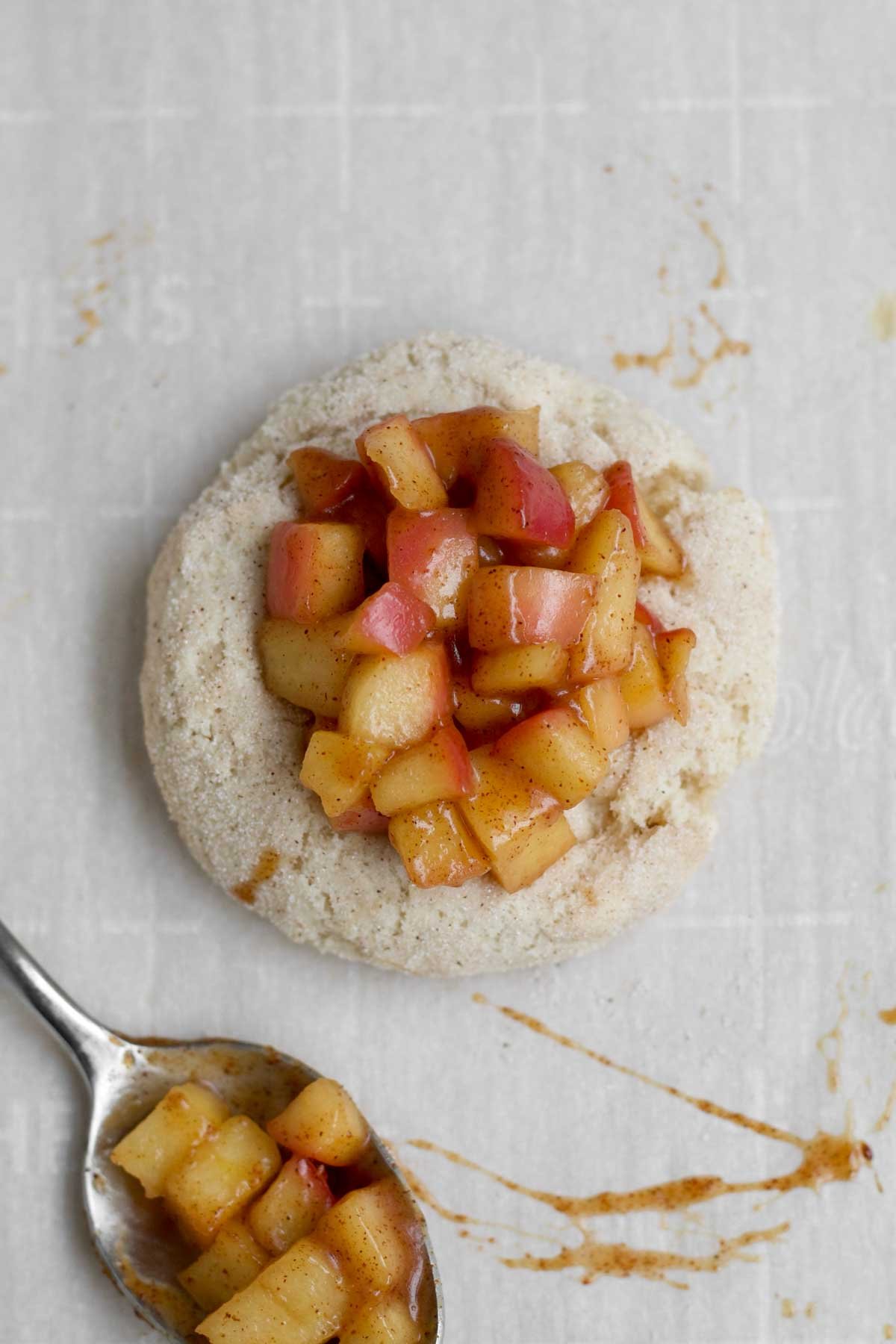 Scooping the warm apple mixture into the cavity.