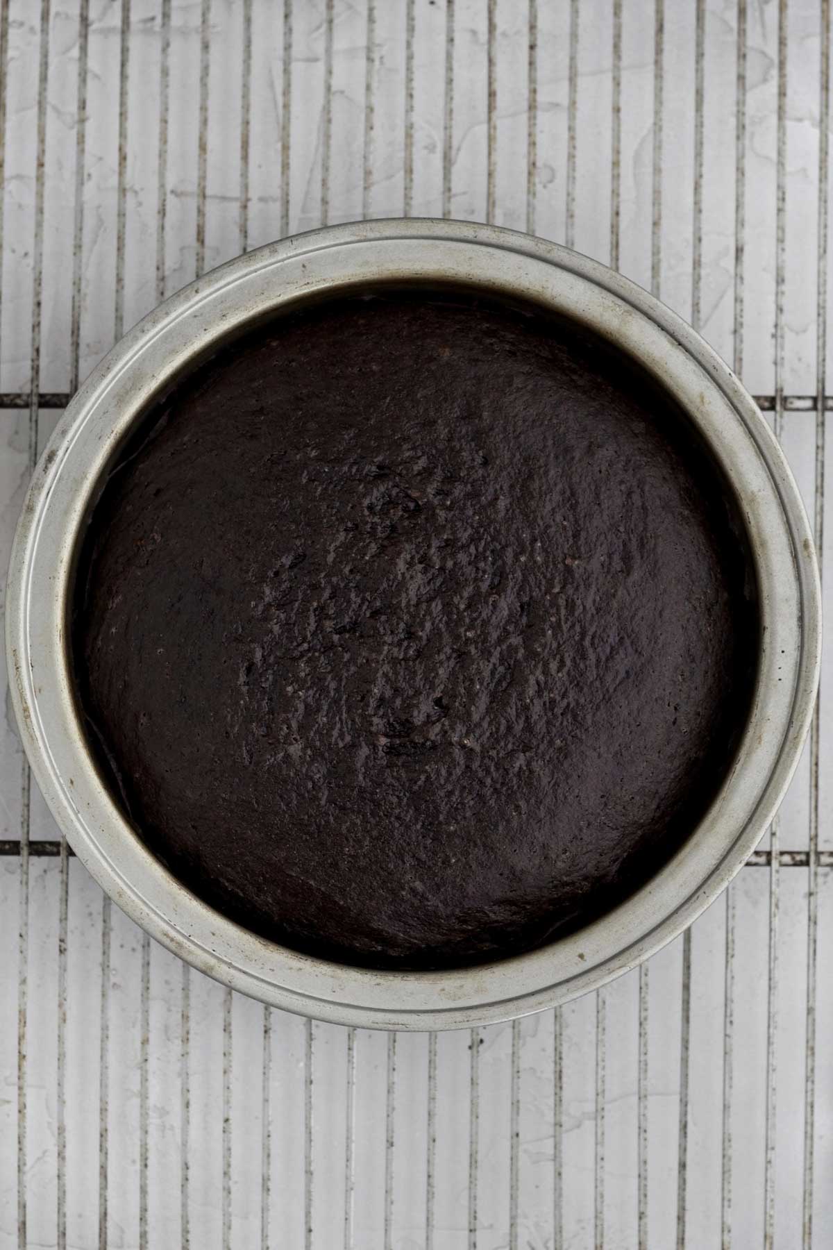 A fresh warm chocolate cake base in a cake tin.