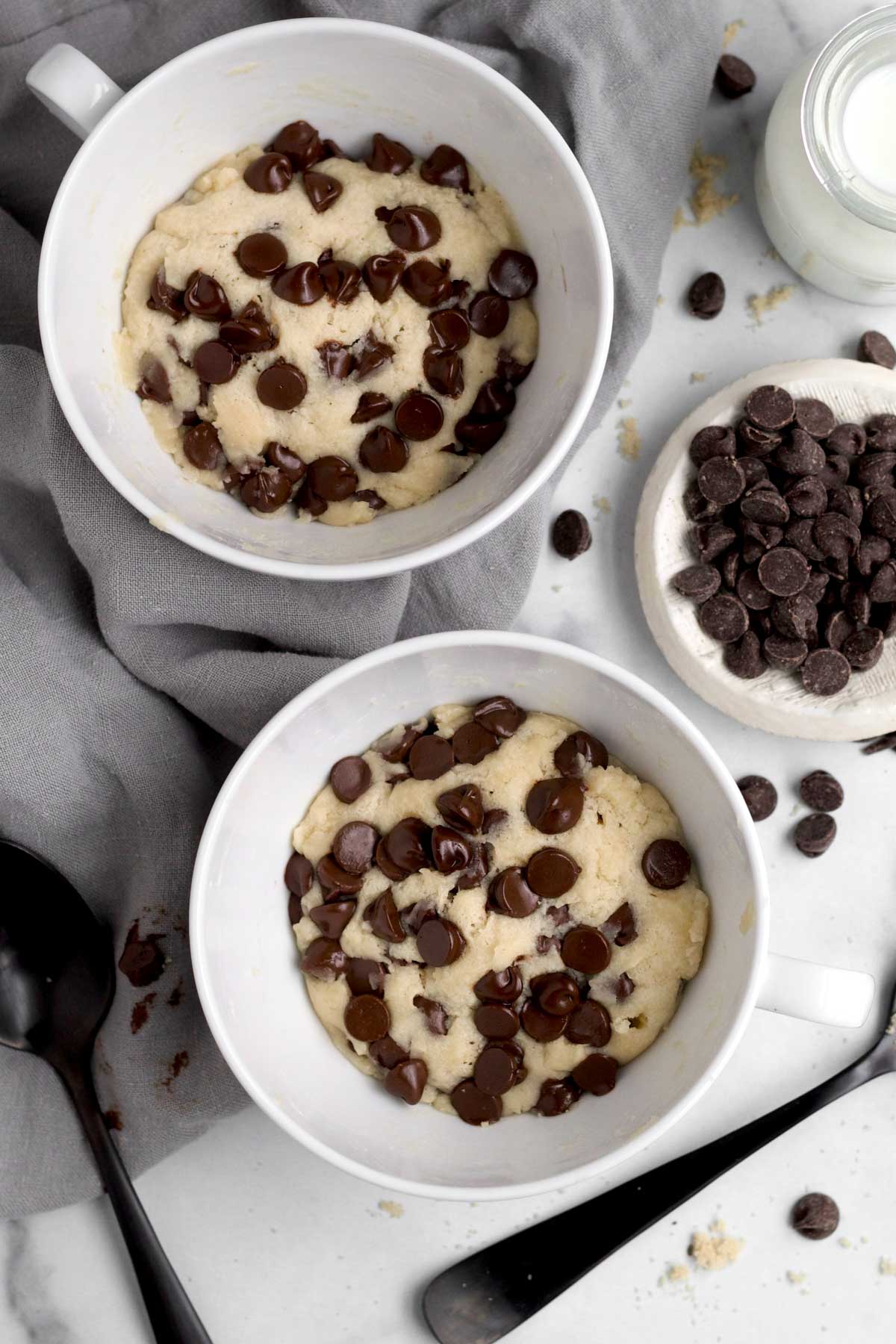 Two warm Cookie Mug Cakes paired for a quick delectable late night/date nite snack.