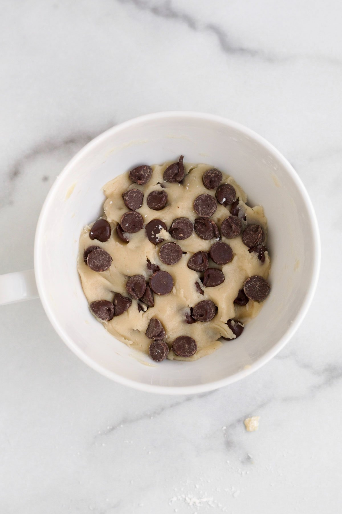Mixing in the dry ingredients and folding in the chocolate chips.
