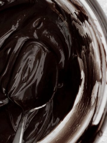 Warm rich decadent chocolate ganache ripples served seductively with a spoon.