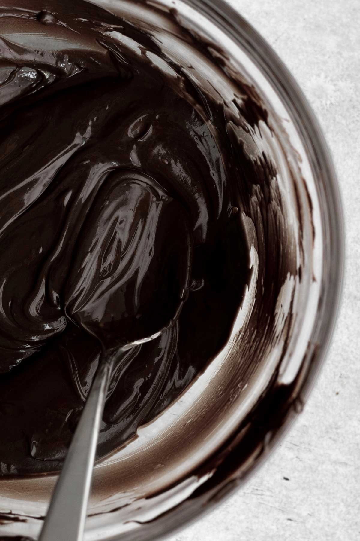 Warm rich decadent chocolate ganache ripples served seductively with a spoon.