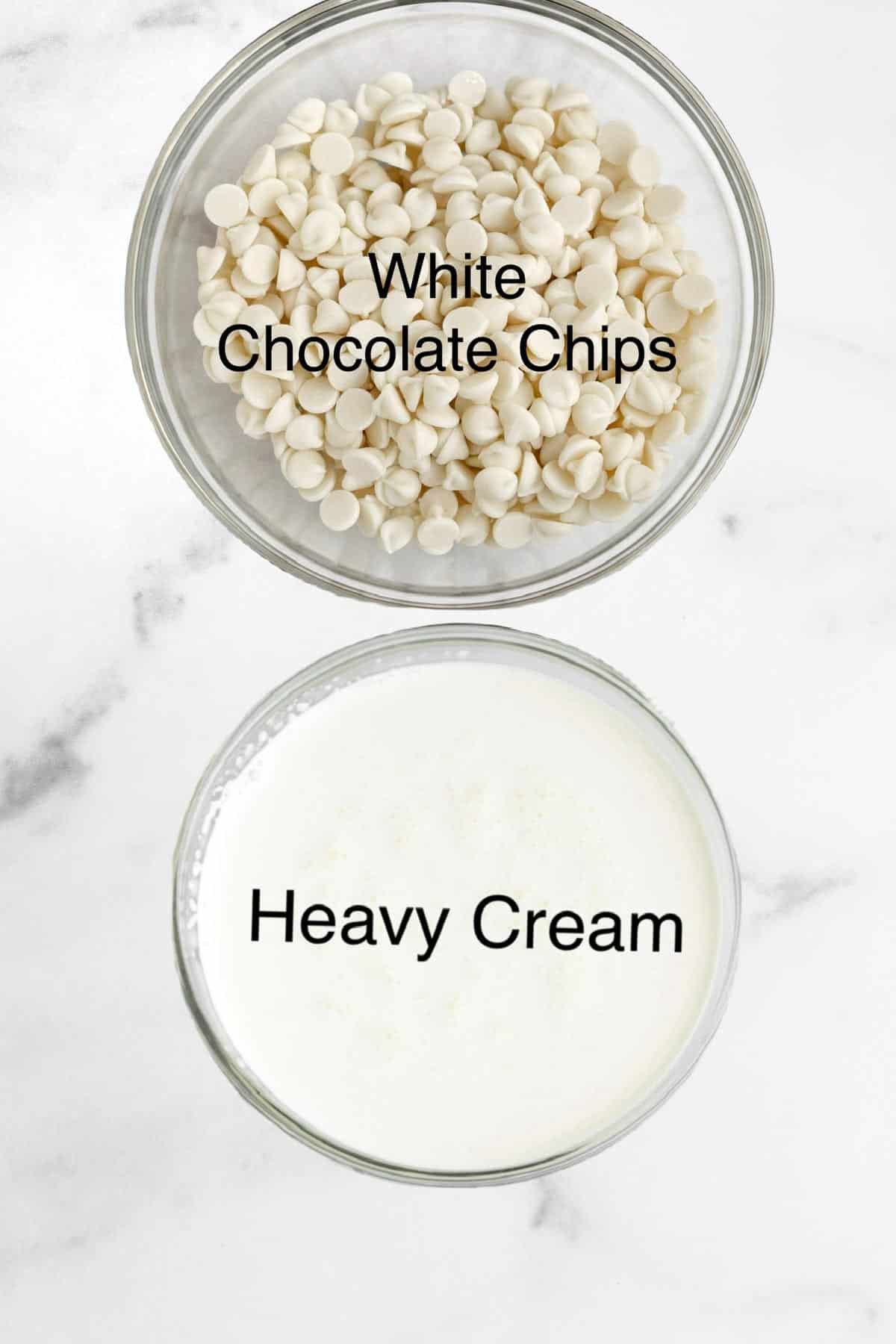 Two bowls of white chocolate chips and heavy cream.