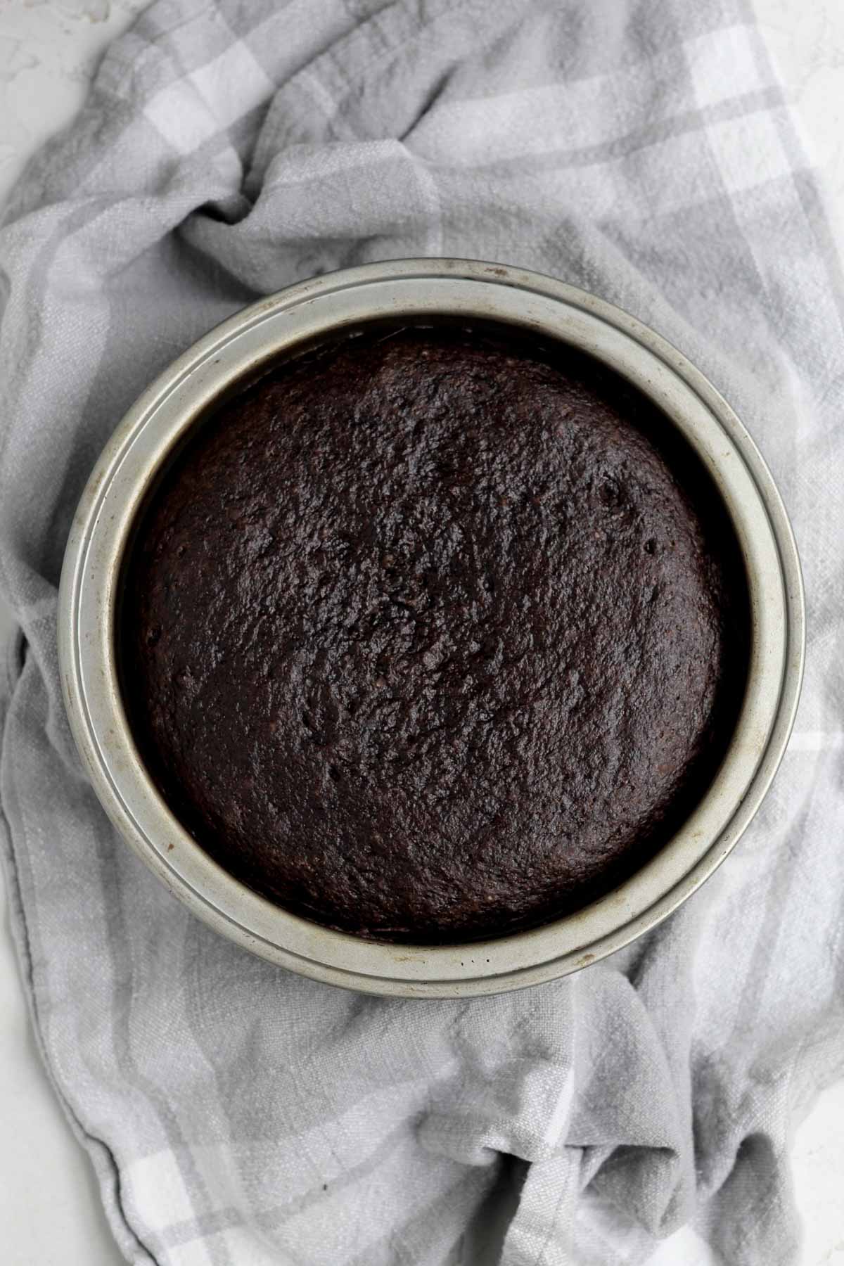 Fresh dark and warm cake in a pan.