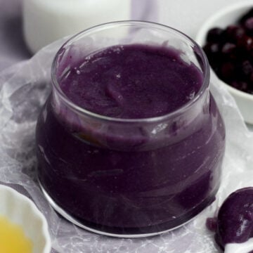 Fresh, silky smooth and sweet Purple Blueberry Curd in a glass jar.