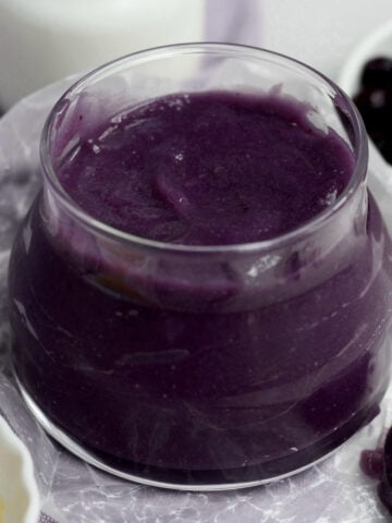 Fresh, silky smooth and sweet Purple Blueberry Curd in a glass jar.