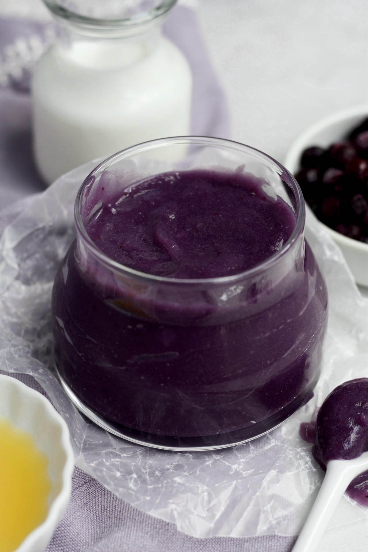 Fresh, silky smooth and sweet Purple Blueberry Curd in a glass jar.