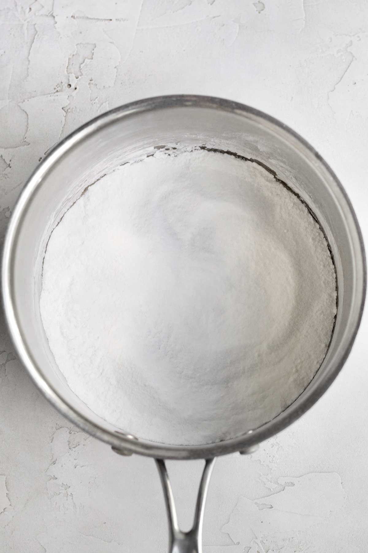 The dry ingredients in a saucepan.