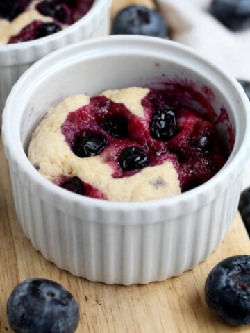 Warm and quick blueberry mug cake ready to be enjoyed.
