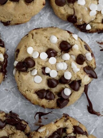 Creamy white chocolate chips and sweet chocolate chips melt slightly atop this crispy cookie.