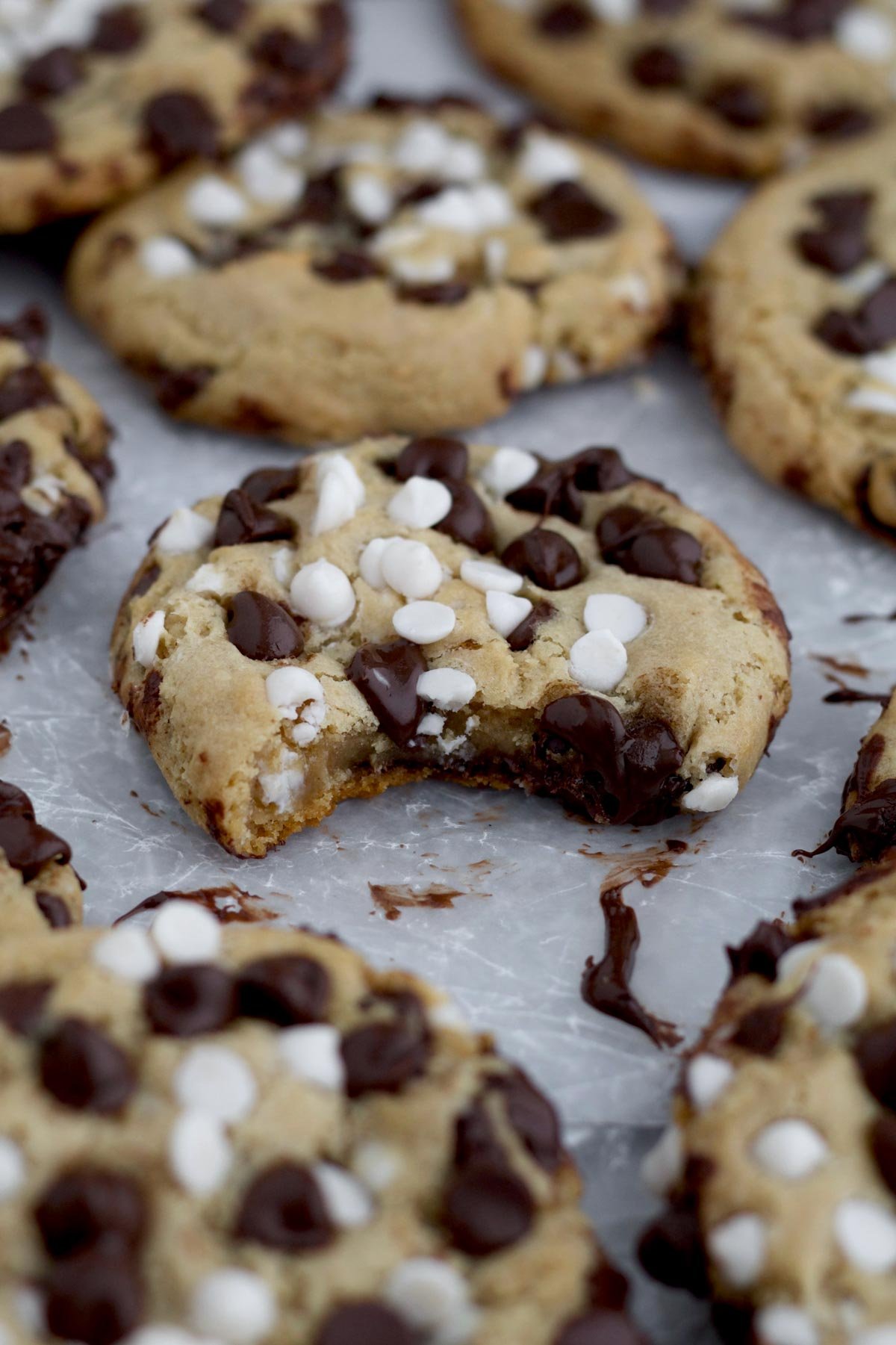 A bite into the delicious Chocolate Chip and White Chocolate Chip Cookie reveals its soft interior.