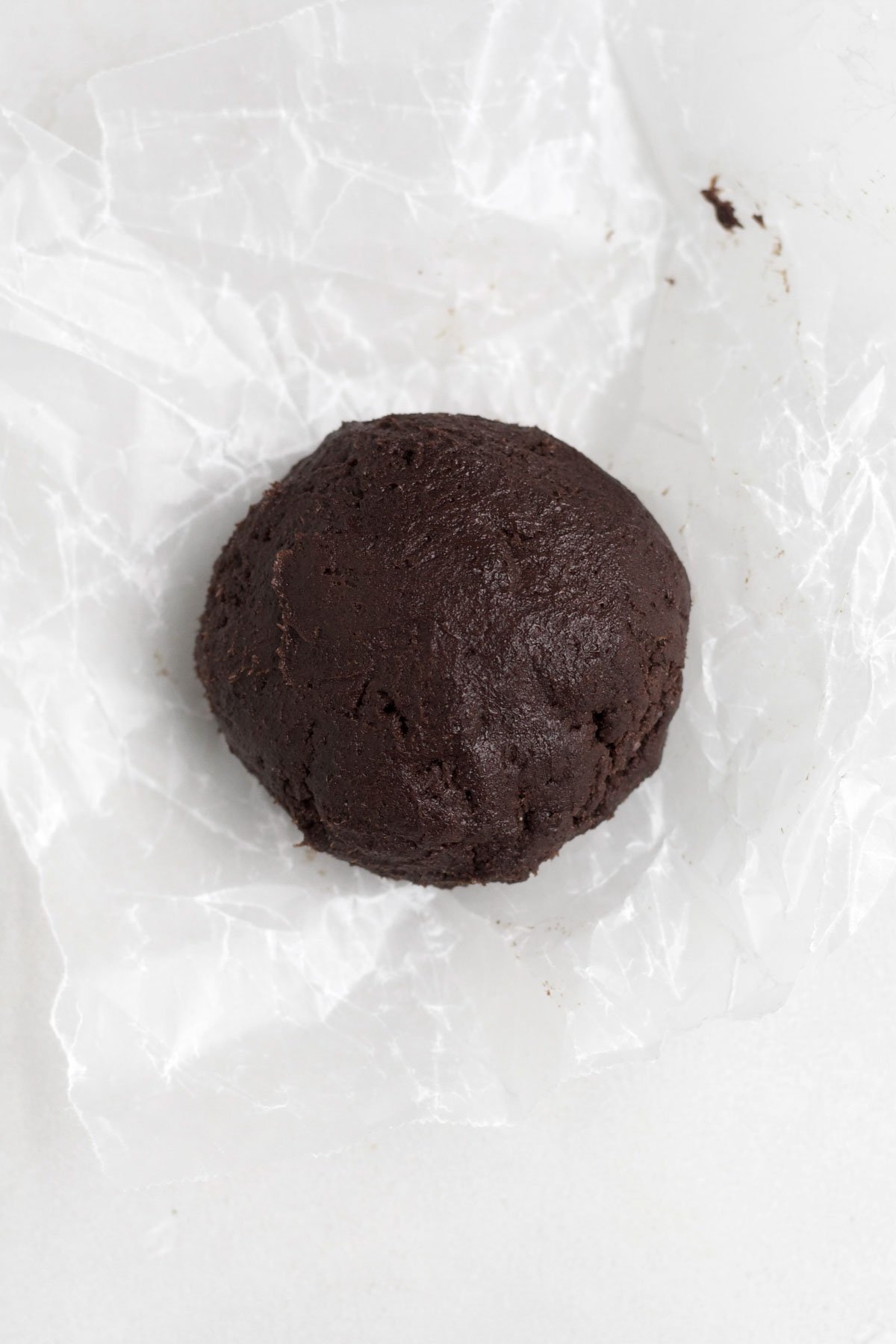 A cookie dough ball stuffed with a whole Rolo.