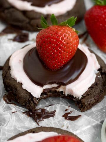 A bite through the sweet layers of ganache, frosting and cookie of the Strawberry Chocolate Cookie.