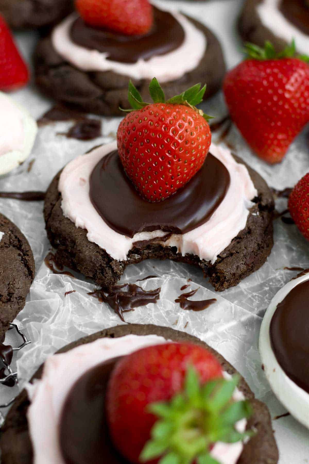 A bite through the sweet layers of ganache, frosting and cookie of the Strawberry Chocolate Cookie.
