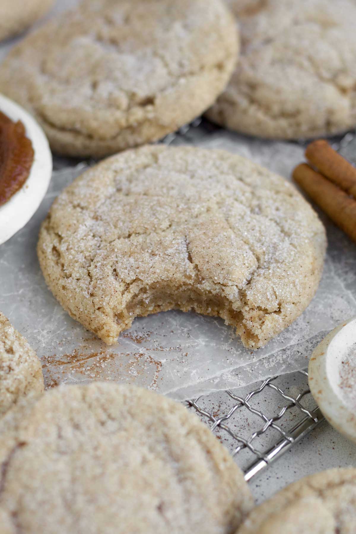 A bite reveals the warm soft interior of the cinnamon sugar topped Apple Butter Cookies.